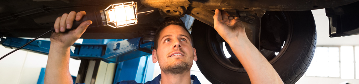Mechanic inspecting a vehicle - MOT Swanage